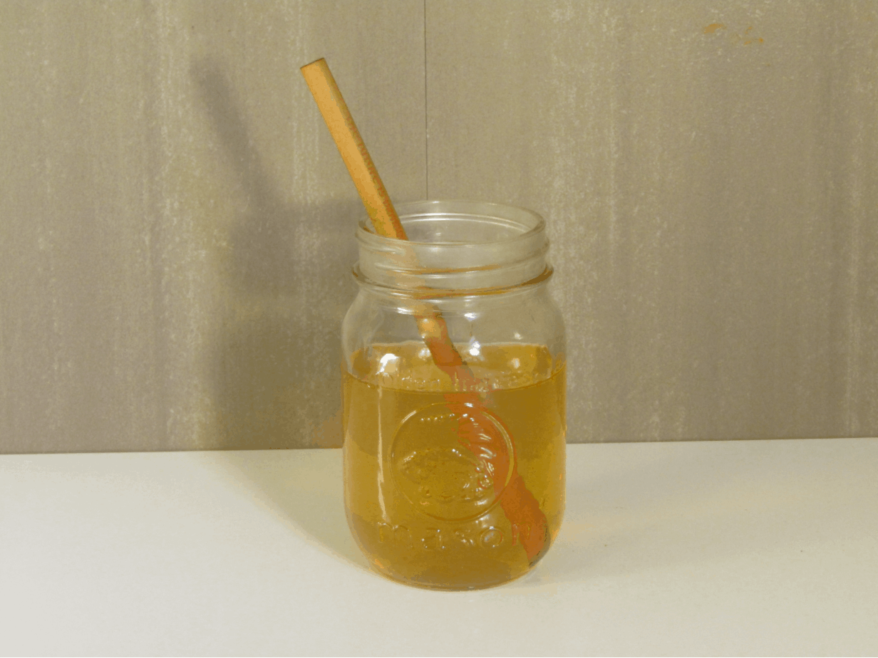 Mason jar filled with kombucha after the first ferment