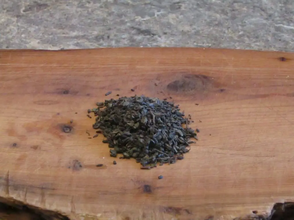 Tea leaves on a cutting board
