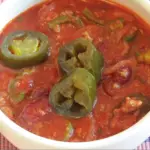 Bowl of chili toped with fermented jalapenos