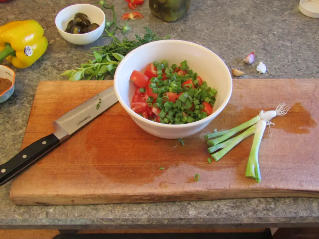 green onion tops sliced and added to fresh salsa ingredients