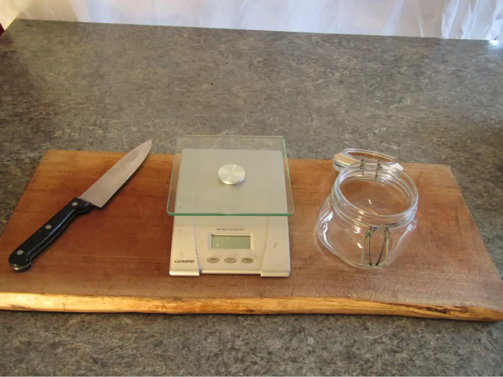 A cutting board, kitchen knife scale and swing top jar