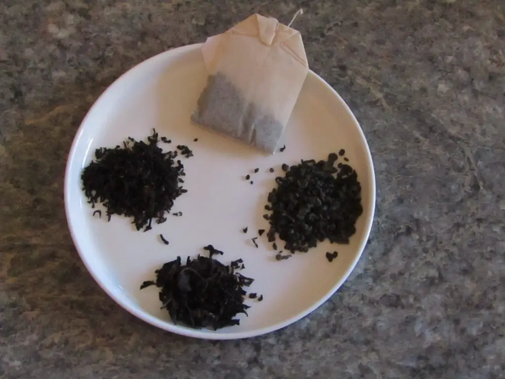 Four types of tea for kombucha: loose leaf green, black and oolong with a black tea bag